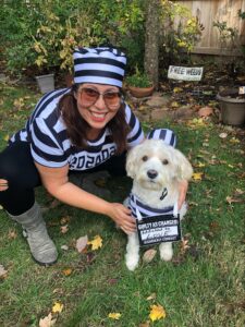 lori and oscar the dog in convict fancy dress costumes